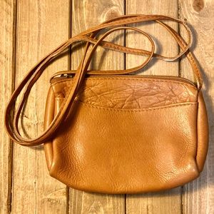 Genuine, leather little long strap purse.